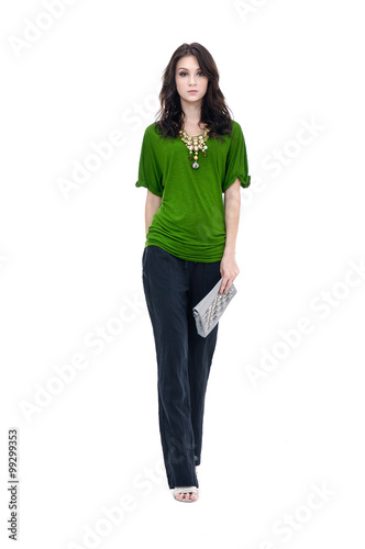 beautiful young woman holding a handbag