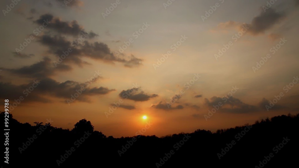 Cloudscape rural sunset with trees on the horizon time lapse ,With Silhouette of tree Cloudscape rural sunset with trees on the horizon time lapse ,With Silhouette of tree