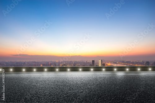 empty floor front of cityscape at sunrise