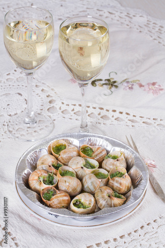 White wine in wine glasses and snails