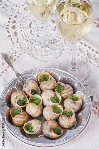 White wine in wine glasses and snails