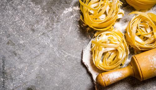 Dry pasta with a rolling pin and flour.