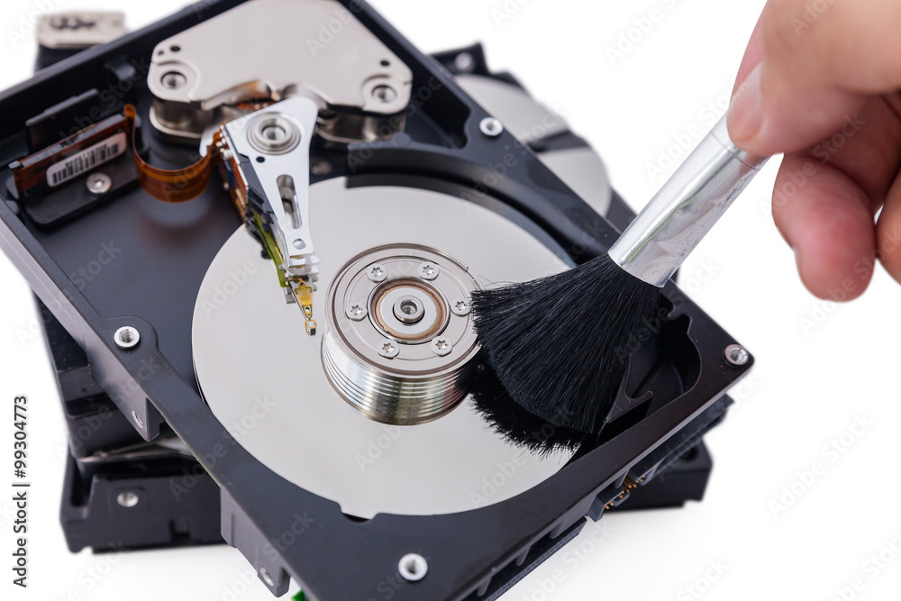 Cleaning data : Clean brush on the hard disk. Stock Photo | Adobe Stock