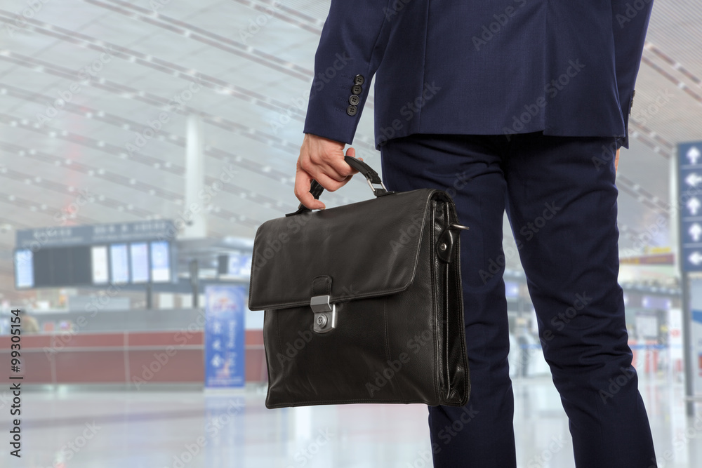  Businessman with a briefcase in airport