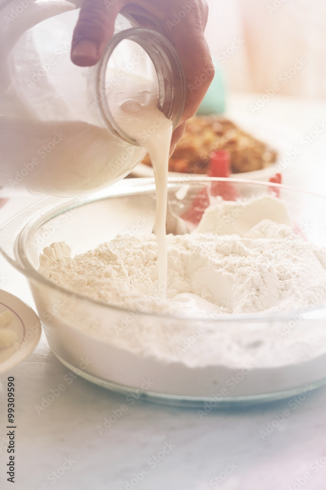 Pour sour milk into flour Pour sour milk into flour