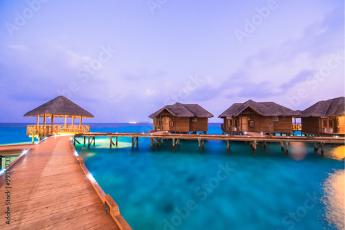 Over water bungalows with steps into amazing green lagoon  © theyok