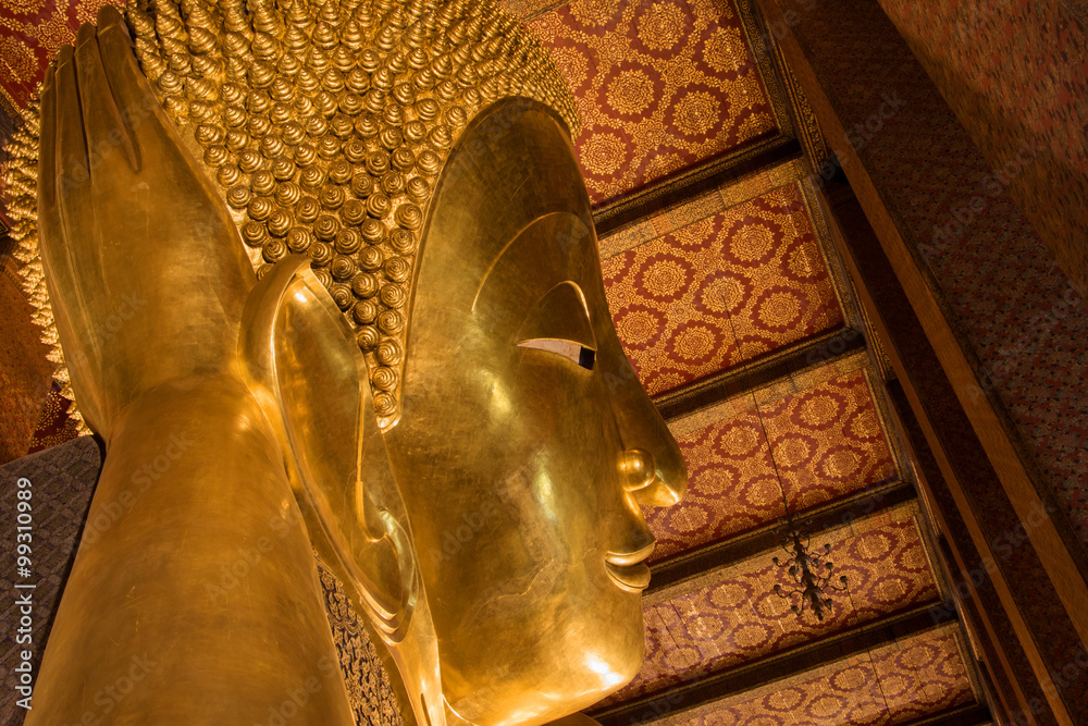 The Giant Golden Reclining Buddha (Sleep Buddha) in Wat Phra Chetuphon Vimolmangklararm Rajwaramahaviharn Temple (Locally known as Wat Pho Buddhist Temple), Bangkok, Thailand