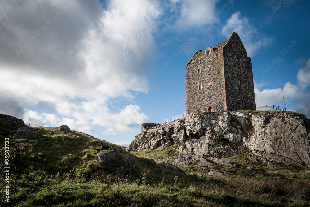 Lonely tower in the Scottish Borders perched on a rocky outcrop
