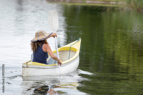 woman rowing in a canoe