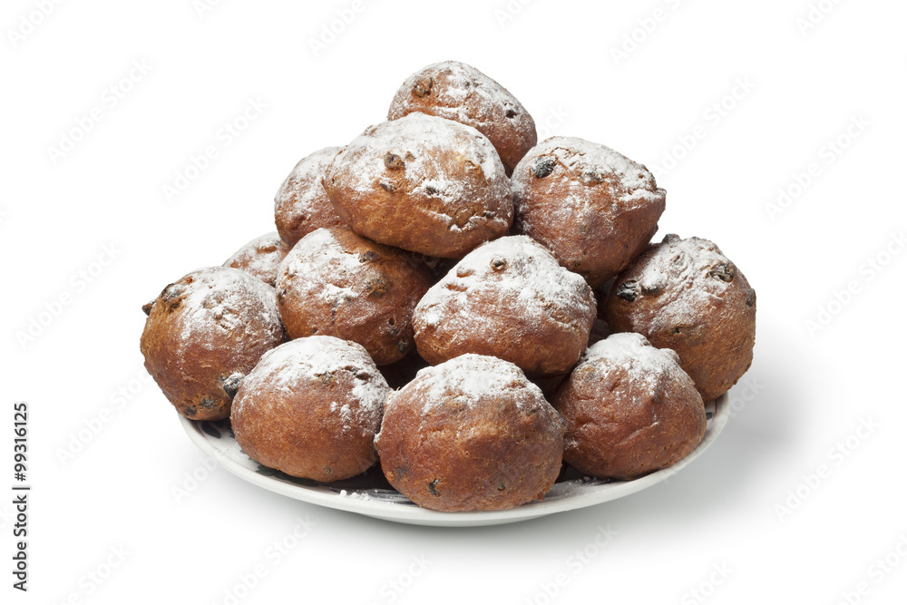 Heap of sugared fried fritters or oliebollen Heap of sugared fried fritters or oliebollen