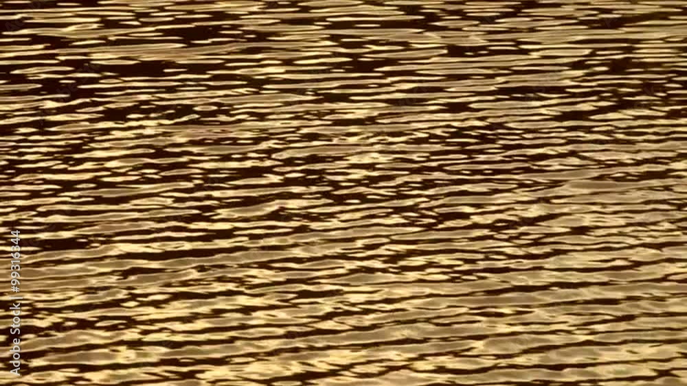 Reflection of the golden sunset shine on water ripple. Meditative and relaxing play of the sun light. Hypnotic motion in the full HD footage with 1080p. Reflection of the golden sunset shine on water ripple. Meditative and relaxing play of the sun light. Hypnotic motion in the full HD footage with 1080p.