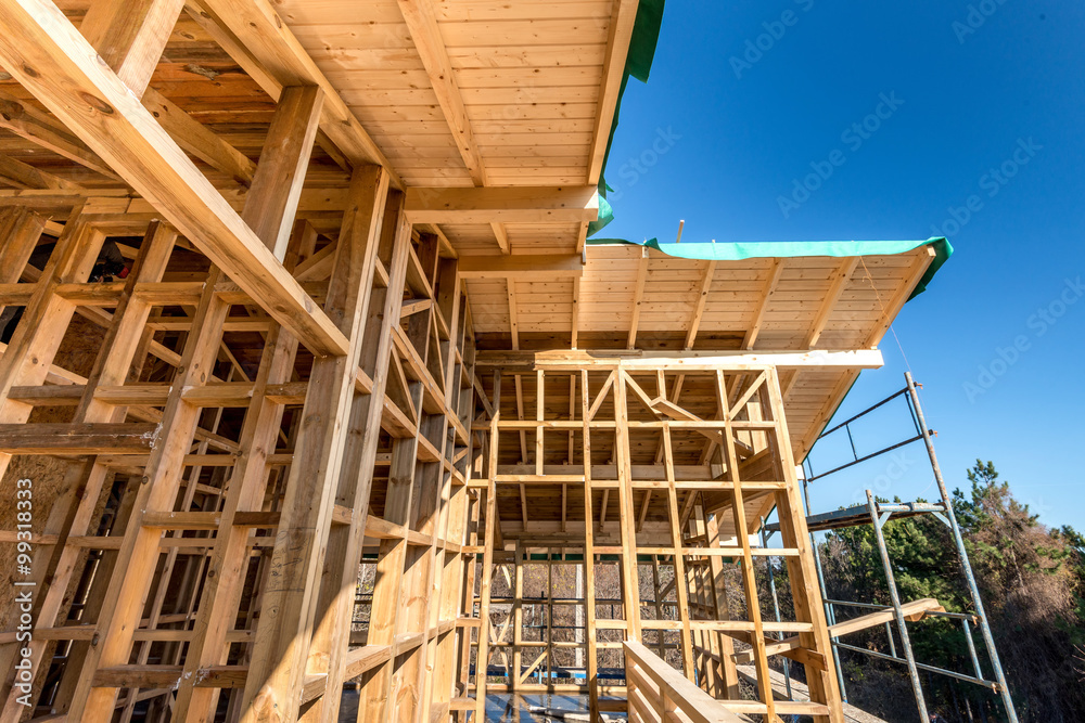 Wooden frame of a new house under construction Wooden frame of a new house under construction