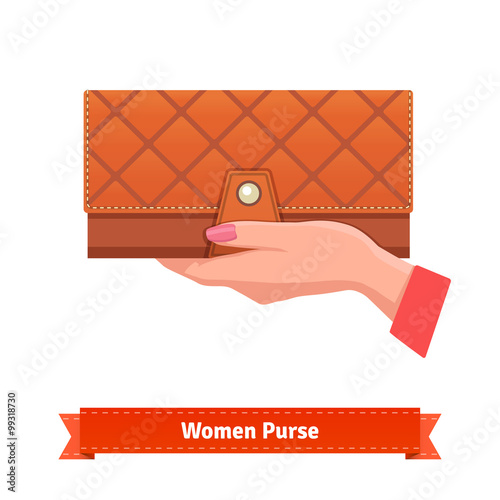 Woman hand holding luxury leather purse