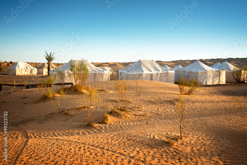 Camp of tents in a beautiful landscape of sand dunes in the desert of Sahara, South Tunisia