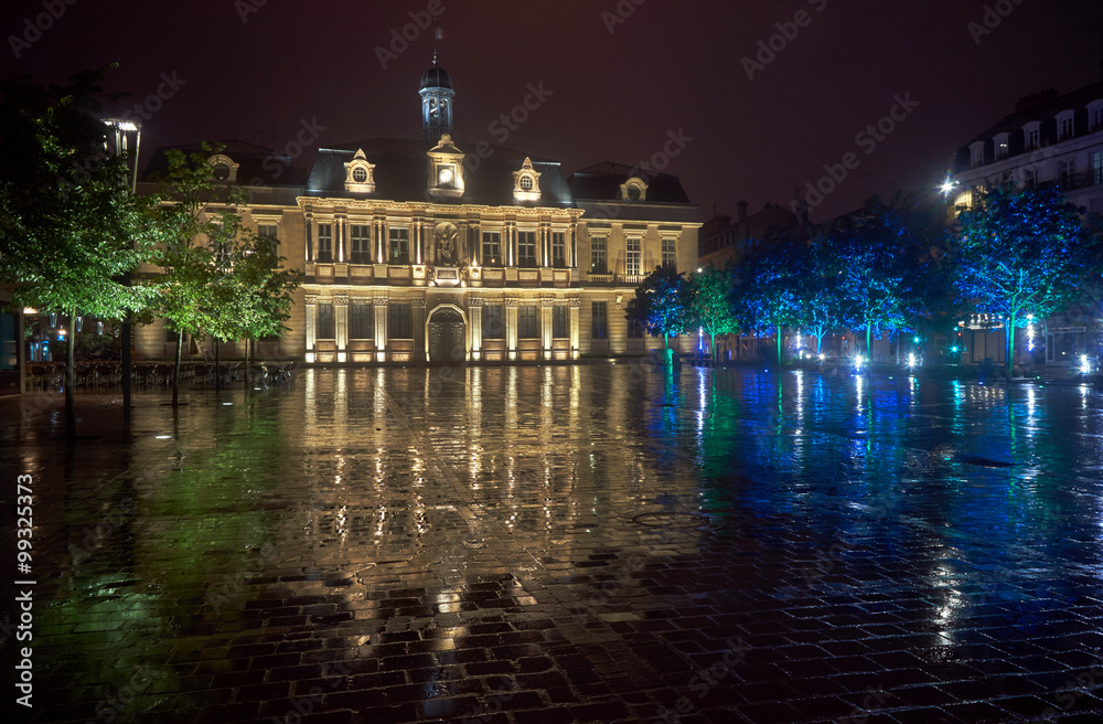 City Hall in the rain at night in Troyes, France .