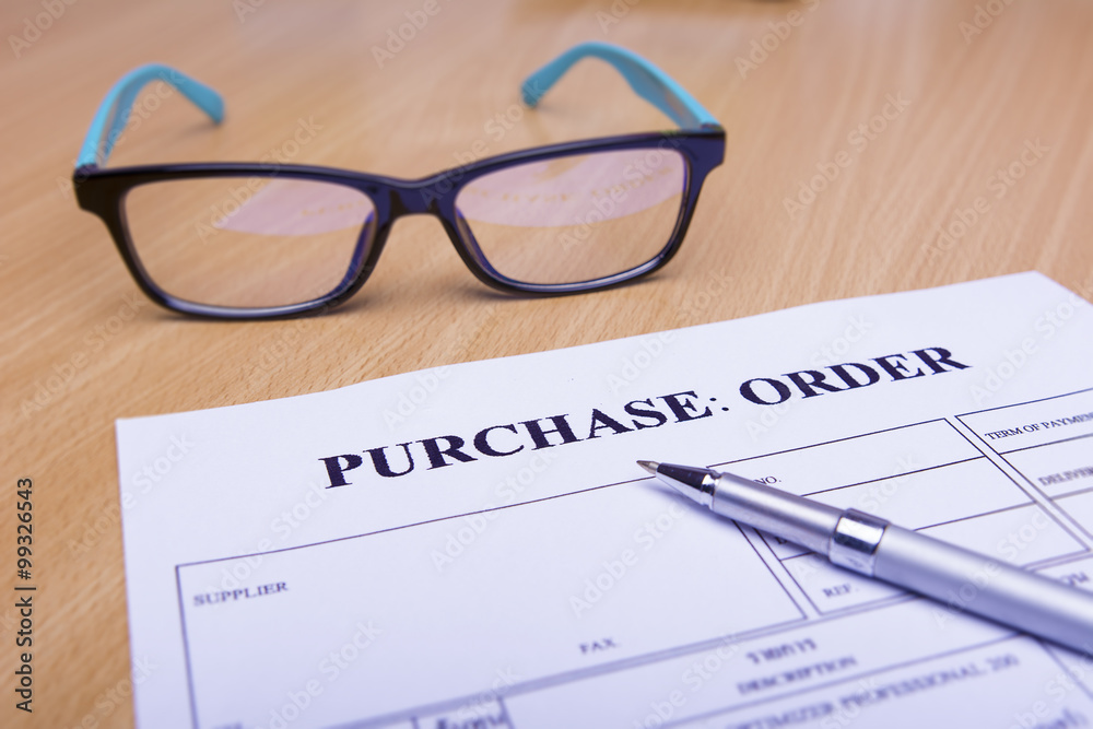 Purchase order form on wooden table Purchase order form on wooden table