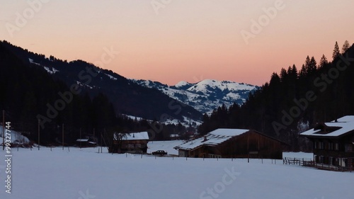 Pink sky over wintery landscape near Gstaad
