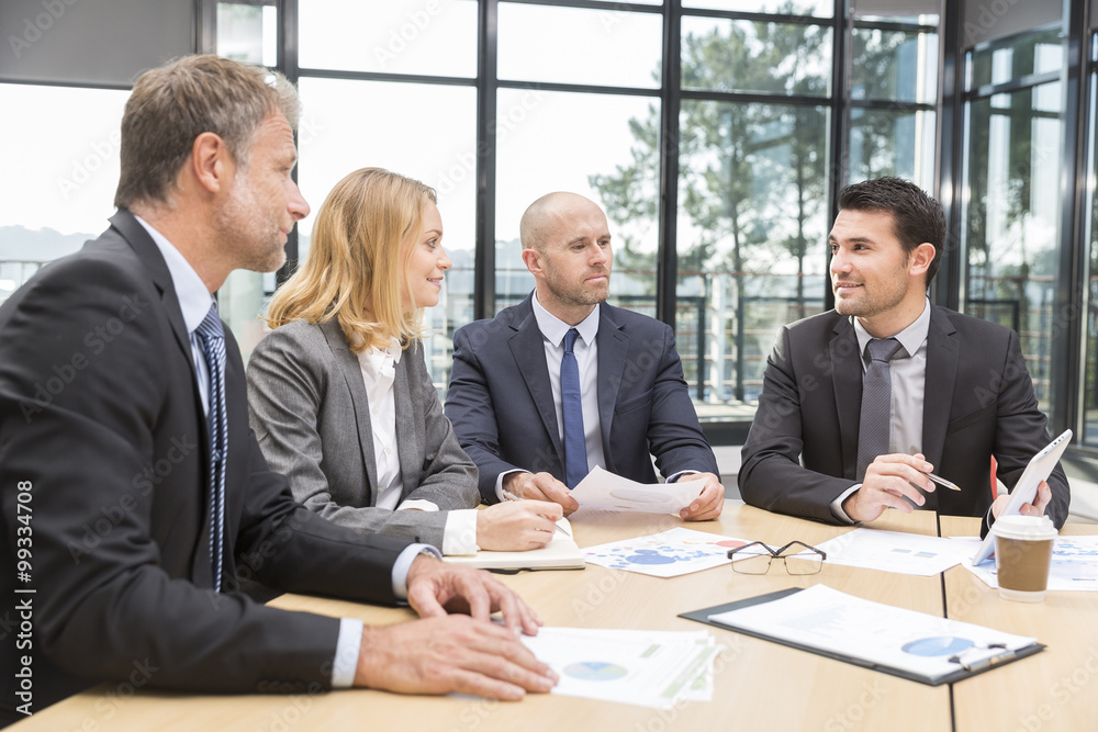 Group of business people having meeting in office Group of business people having meeting in office