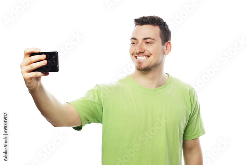 young man making photo of himself