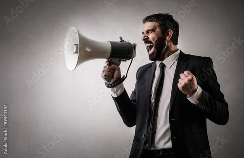 Fierce employee with a megaphone photo