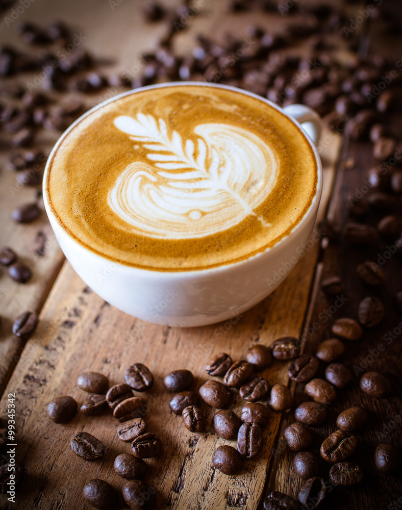 Fototapeta Cup of coffee latte in coffee shop