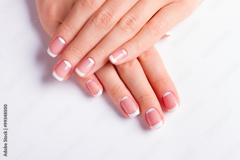 Neat manicure on a white background.