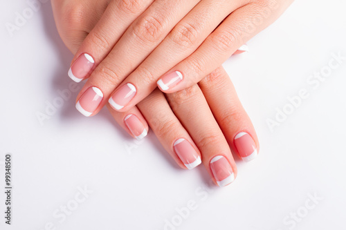 Neat manicure on a white background.