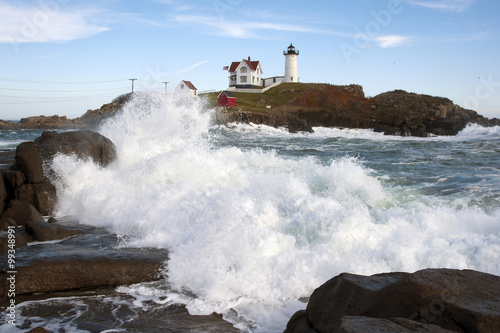 Waves crashing at high tide near Cape Neddick llighthouse, also known as Nubble light, in Maine.