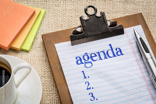 agenda list on clipboard and coffee photo