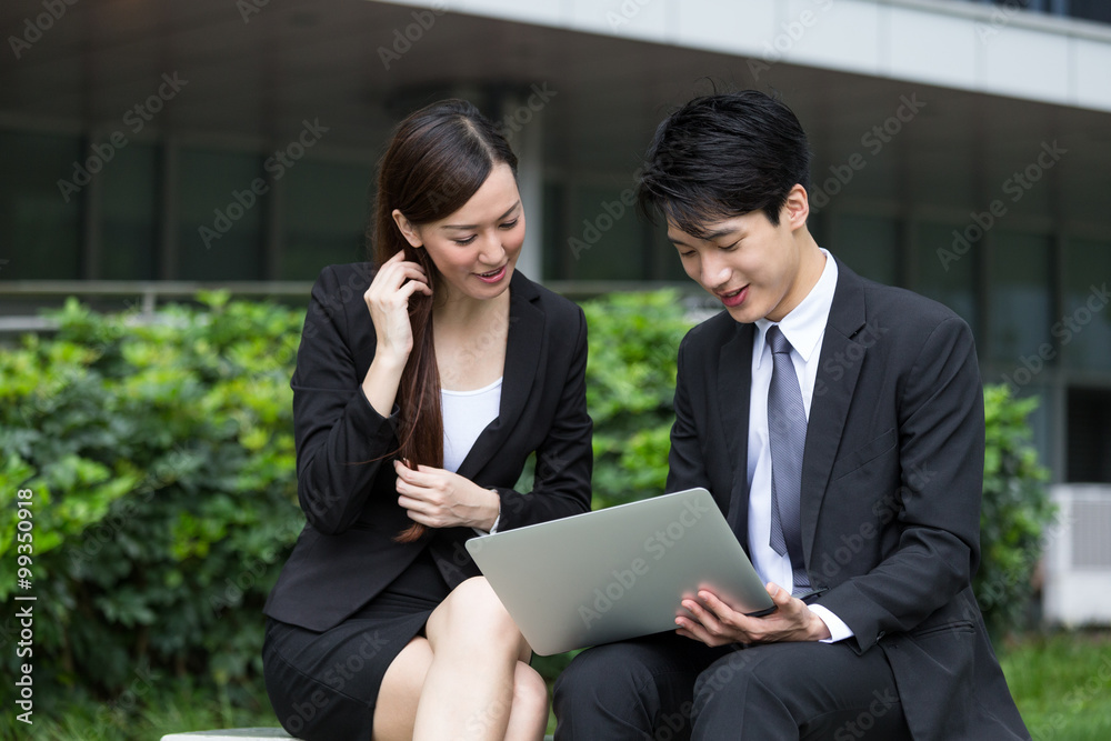 Business pepole work together on laptop computer