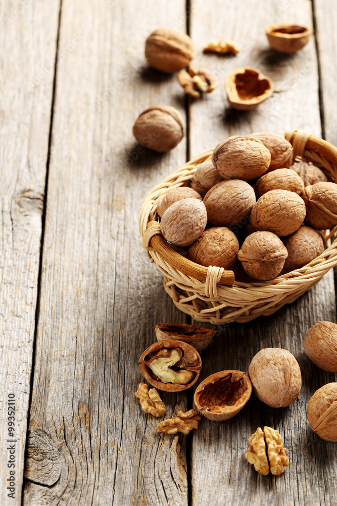Walnuts on a grey wooden table Walnuts on a grey wooden table