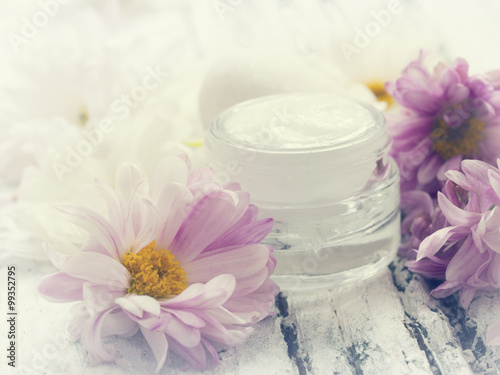 facial cream with fresh flowers