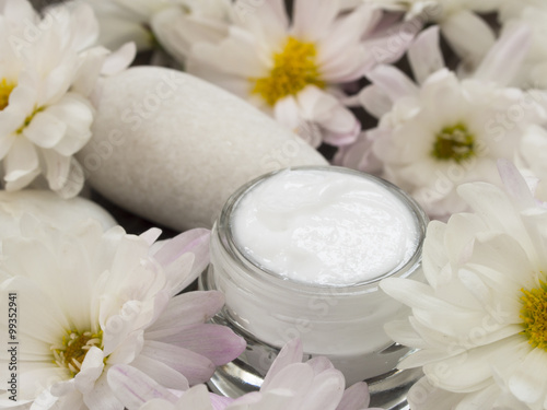 facial cream with fresh flowers