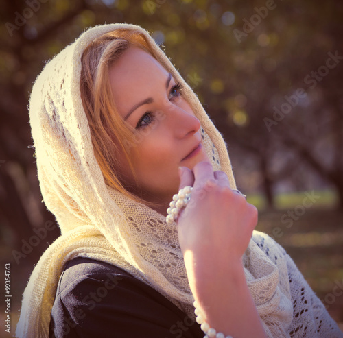 Young beautiful girl with a shawl photo