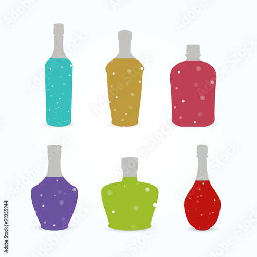 Different bottles with colorful sparkling liquid