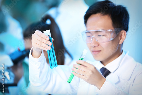 Young male medical technician working in laboratory