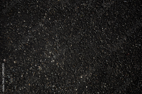 The texture of fresh asphalt lined up close. Pavement
