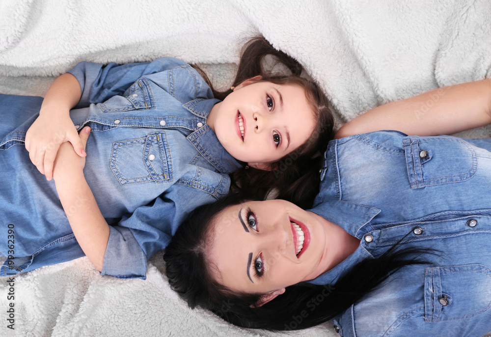 Mother and daughter on the sofa closeup