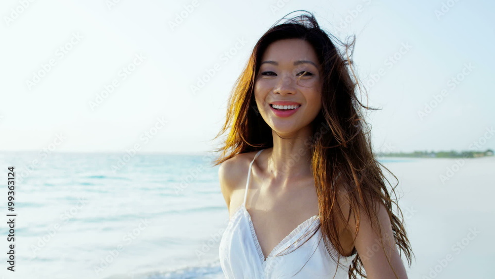 Carefree ethnic girl at luxury resort barefoot on sand Carefree ethnic girl at luxury resort barefoot on sand