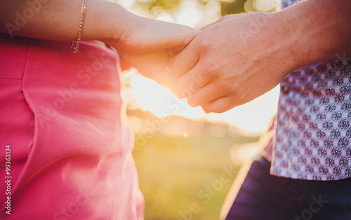 Valentine Couple in love showing Heart with their fingers.