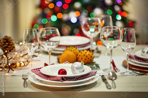 Christmas table setting with holiday decorations background