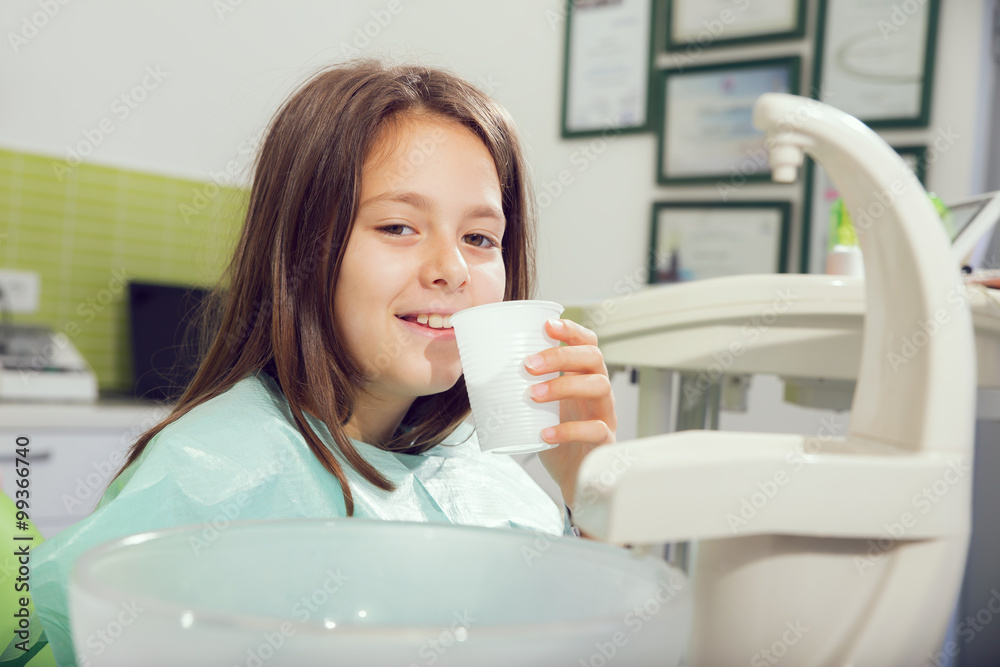 Little girl sitting in the dentists office Little girl sitting in the dentists office