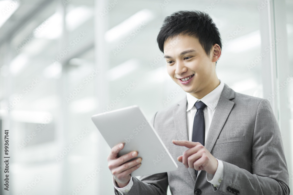 Young businessman with digital tablet Young businessman with digital tablet