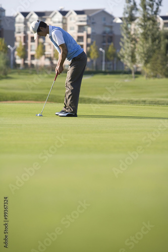 Golfer putting on the Green