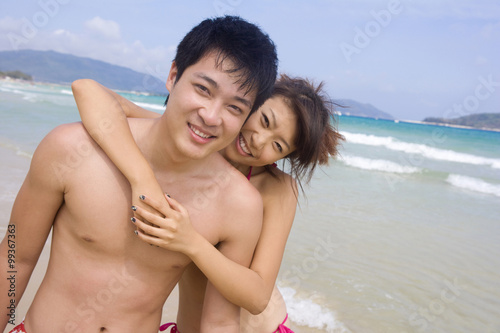 Young couple having fun at the beach