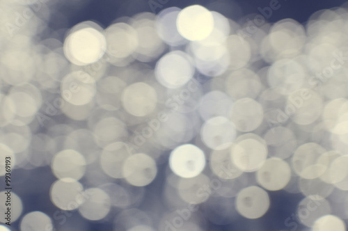 Bokeh illustration with big glowing round light spots on background copy space