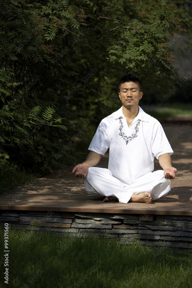 Fototapeta premium Man Meditating Outdoors