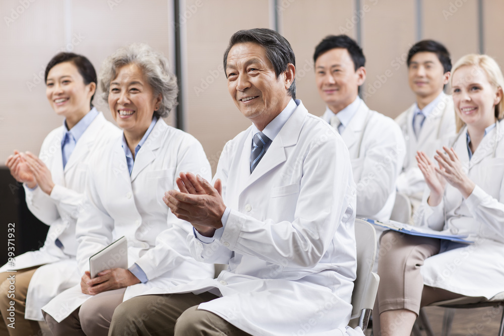 Medical workers clapping in a meeting Medical workers clapping in a meeting