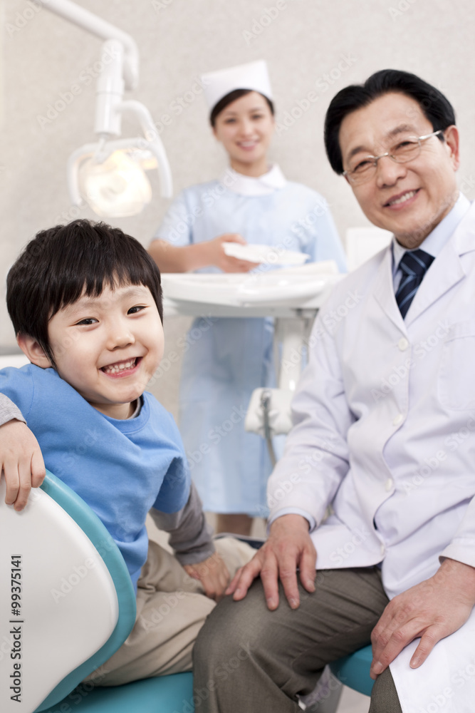 Little patient receiving treatment in dental clinic Little patient receiving treatment in dental clinic