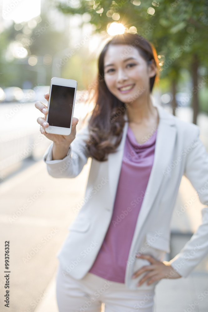 Young woman showing smart phone Young woman showing smart phone